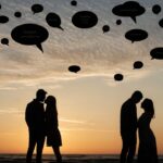 A couple's silhouette with thought bubbles filled with symbols instead of words